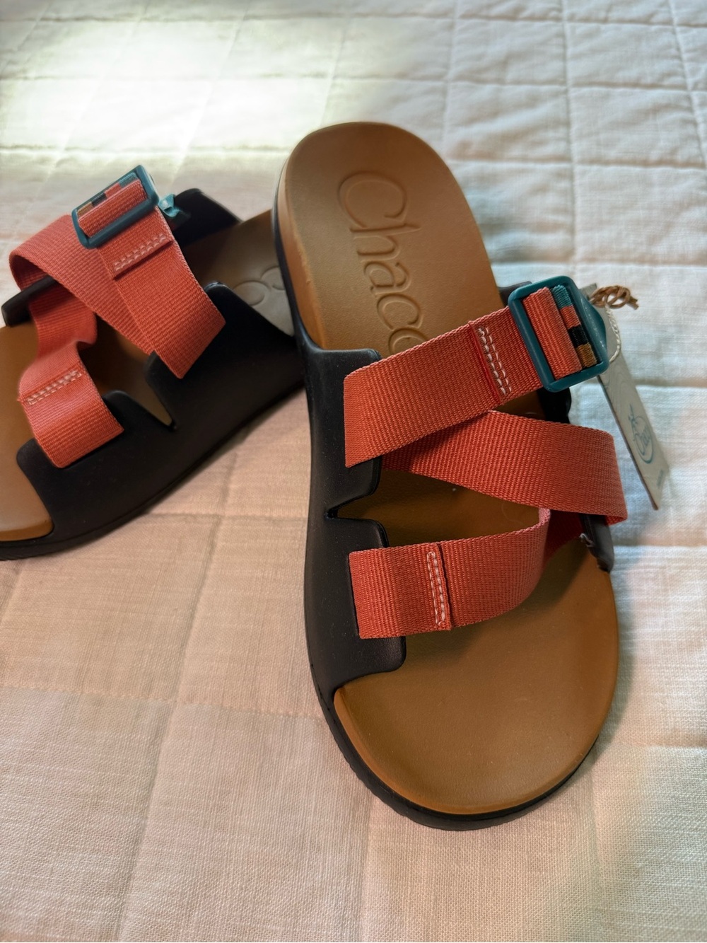 Chaco Woman’s Black and Coral Strap Sandals with Teal Buckles
